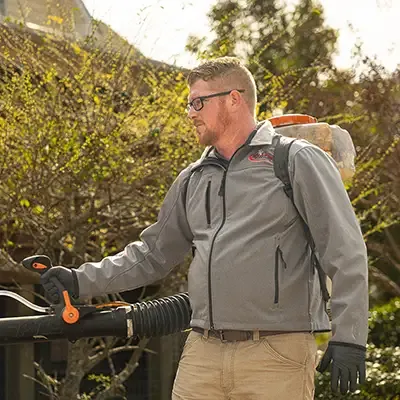 technician spraying for mosquitoes